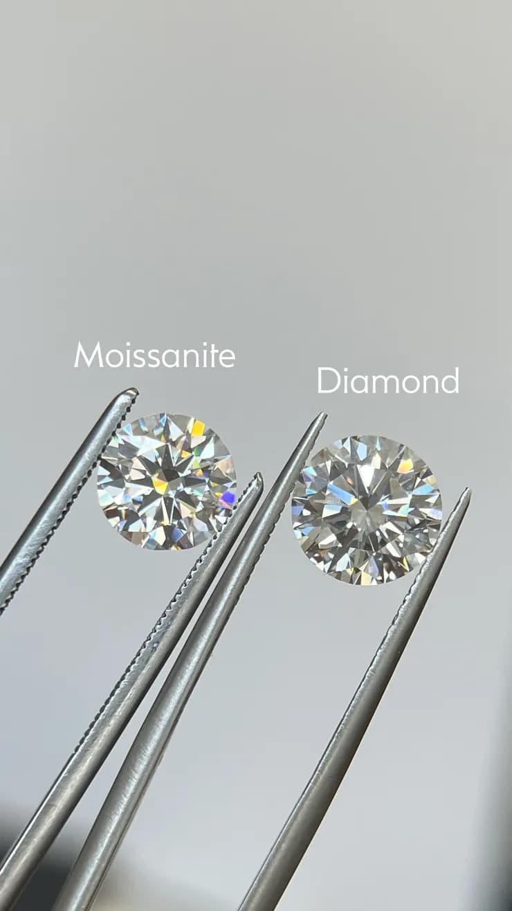 Side-by-side comparison of moissanite and diamond gemstones held in tweezers